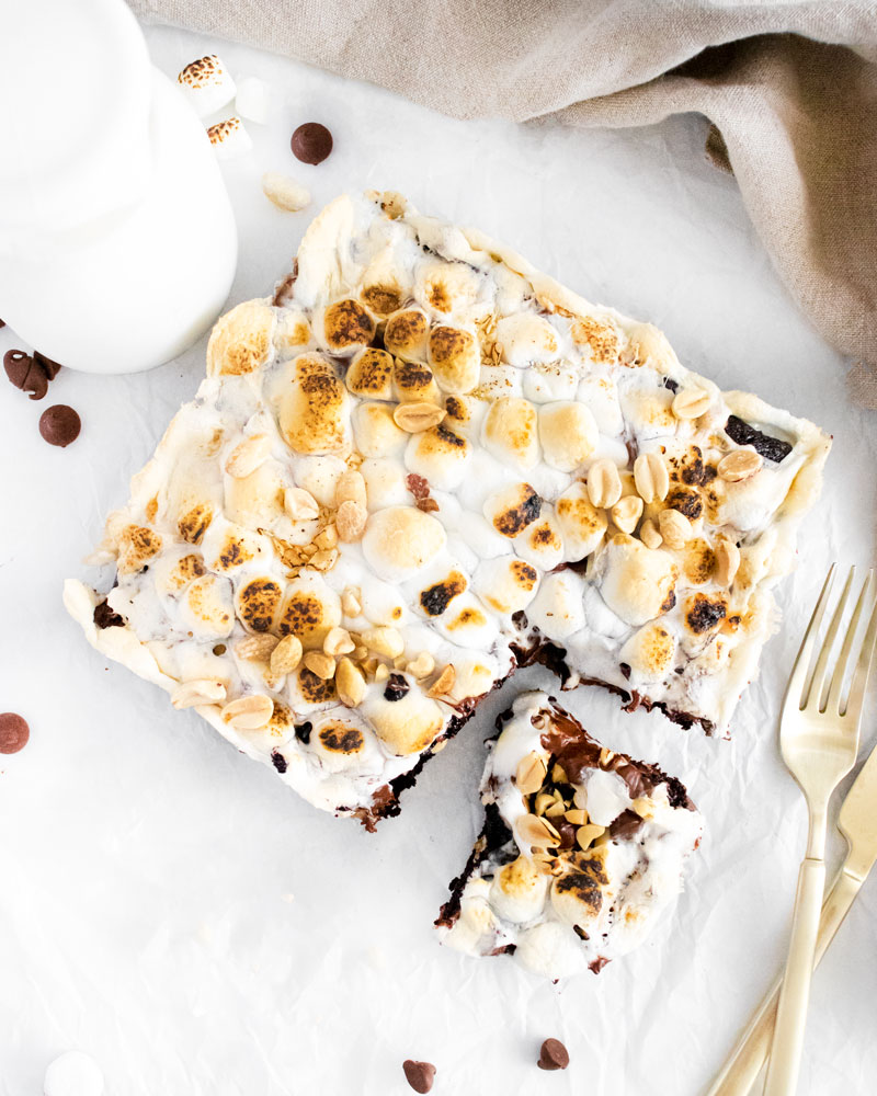 Flatlay of brownies showing toasted marshmallows on top. 